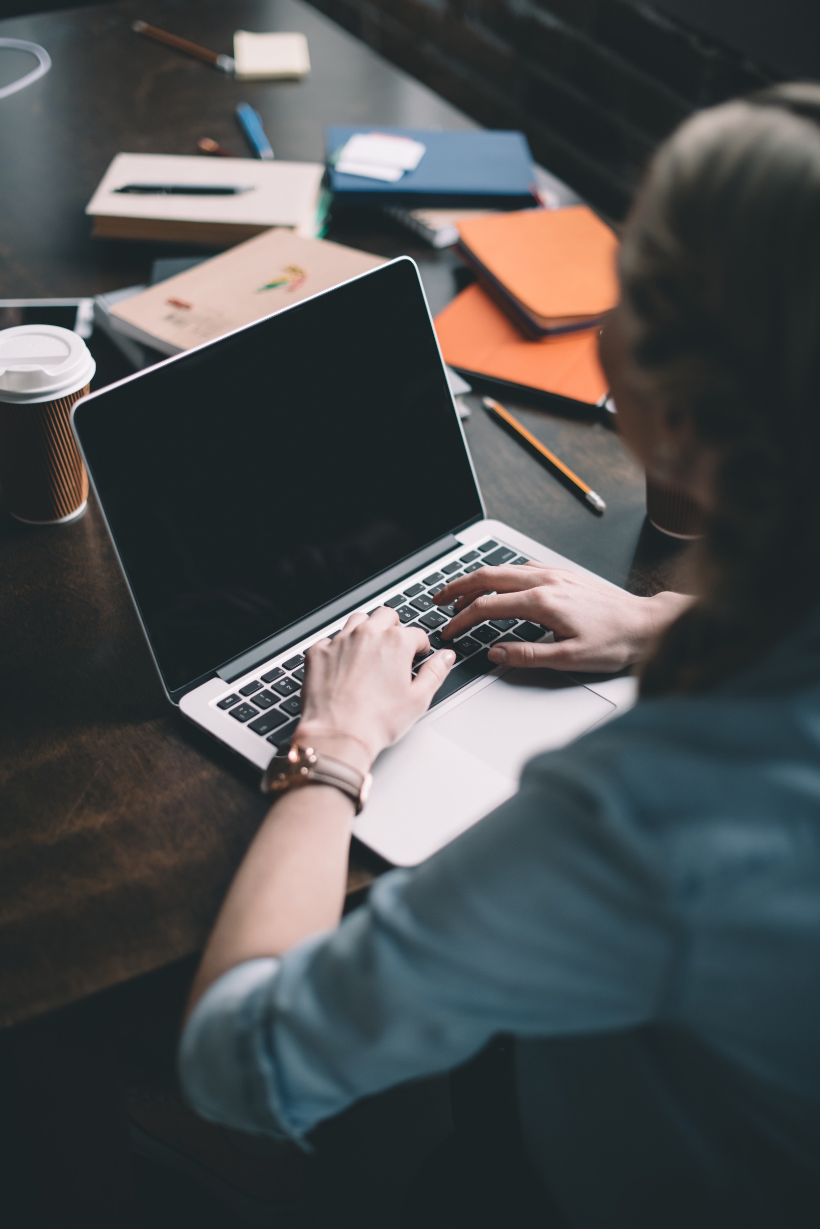 woman typing on laptop