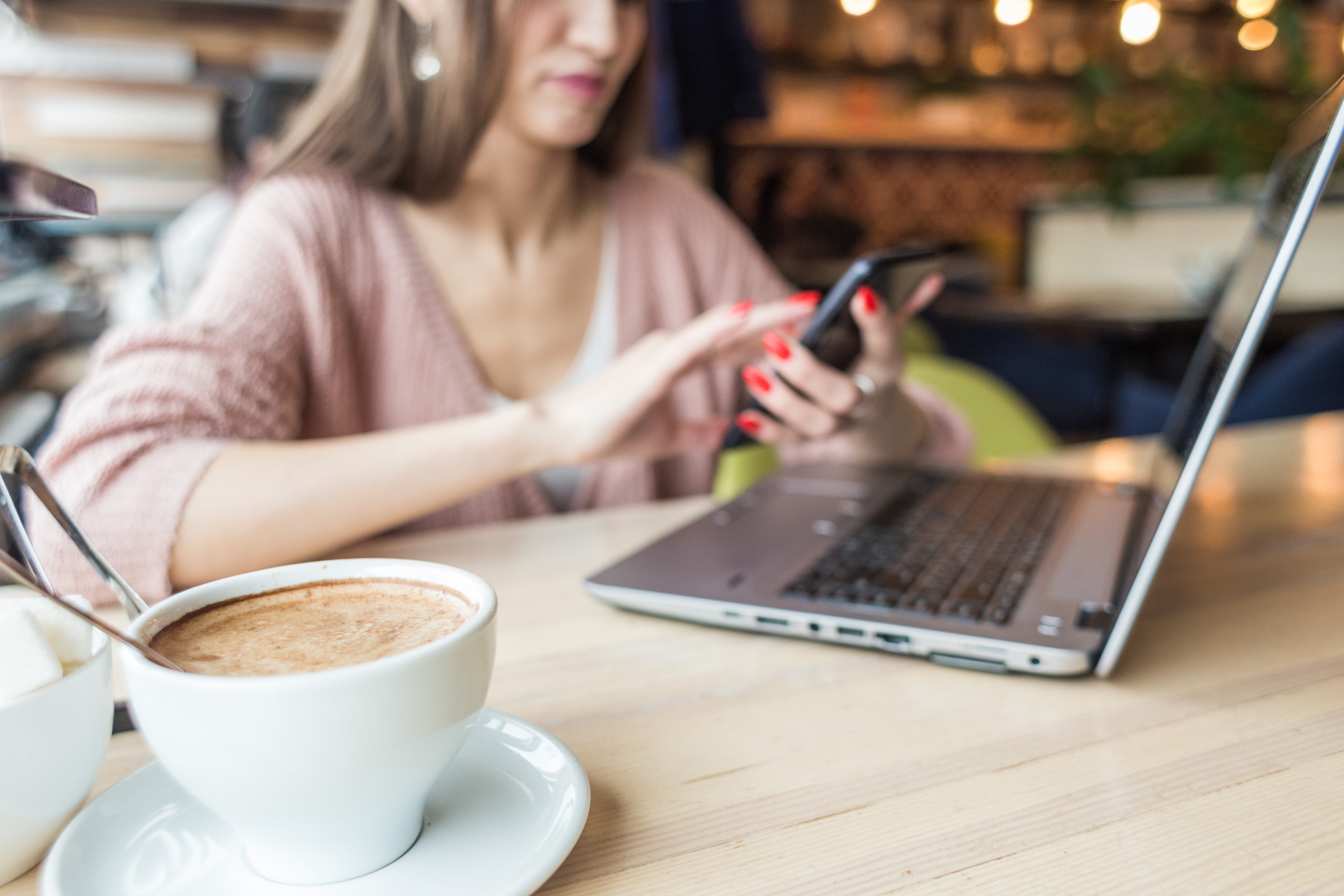 lady at laptop with coffee