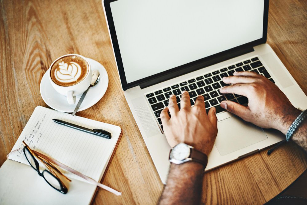 man typing laptop
